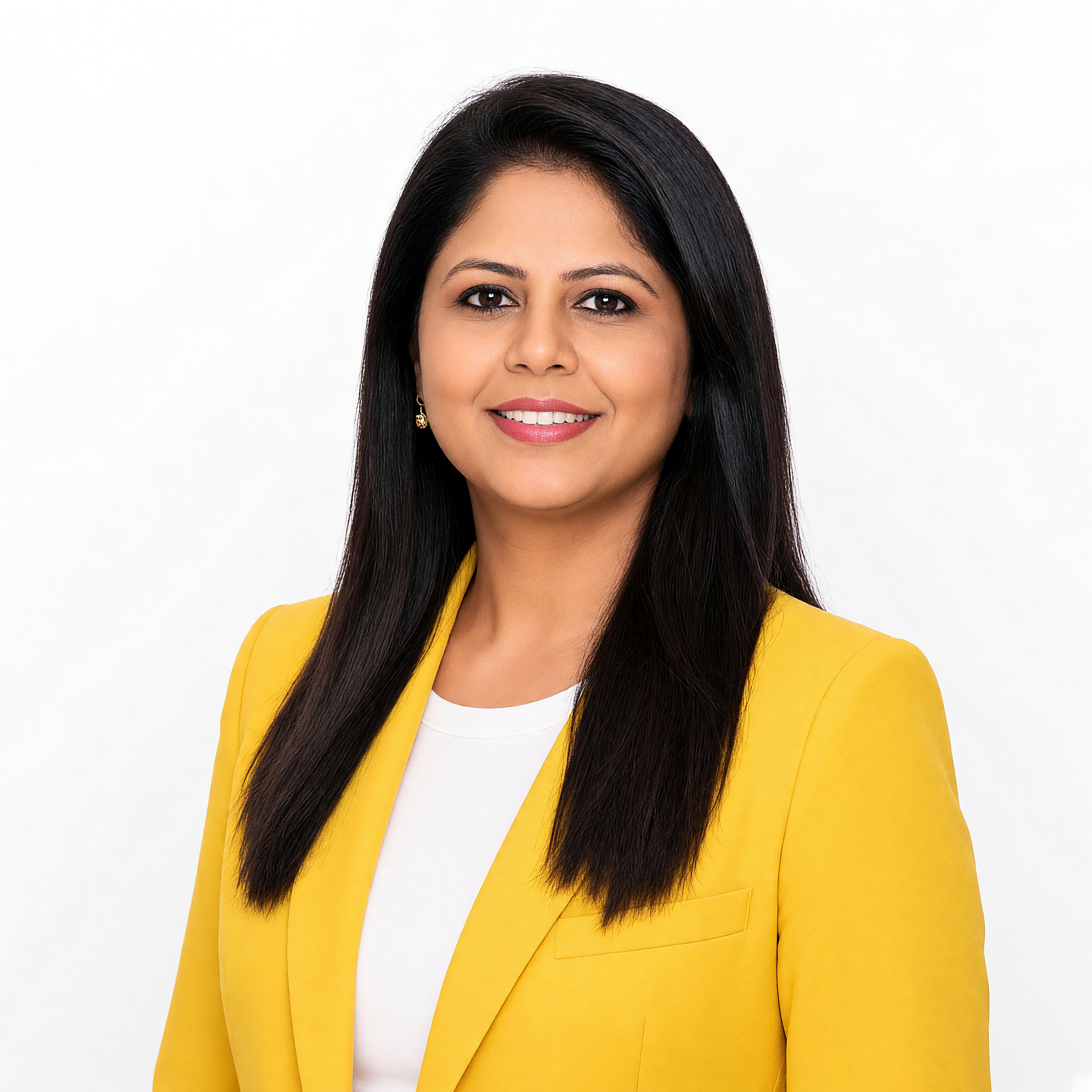Priyanka — current likeness in the yellow studio blazer